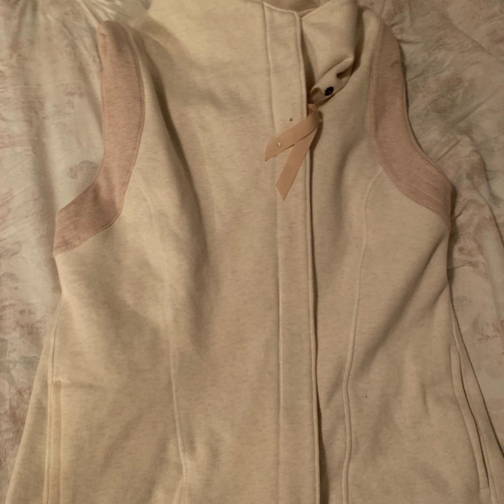 Limited addition, beige, and pink lululemon vest